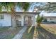 Welcoming front entrance with brick accents, arched columns, and a beautifully landscaped yard at 1616 39Th Avenue E Dr, Ellenton, FL 34222