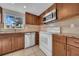 Functional kitchen featuring a window above the sink and stainless steel appliances at 1616 39Th Avenue E Dr, Ellenton, FL 34222