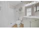 Bright bathroom featuring a single sink vanity, tile floor, and shower-tub combination at 1618 39Th Avenue E Dr, Ellenton, FL 34222
