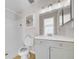 Bathroom with a shower, toilet, and vanity with mirror at 1618 39Th Avenue E Dr, Ellenton, FL 34222