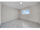 Bedroom with large window, tile flooring, and neutral paint providing a bright and spacious atmosphere at 1618 39Th Avenue E Dr, Ellenton, FL 34222