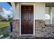 Home entrance showing front door, brick detail, and an inviting welcome to the property at 1618 39Th Avenue E Dr, Ellenton, FL 34222