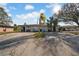 Charming residential duplex with a shared driveway, mature trees and well-maintained landscaping at 1618 39Th Avenue E Dr, Ellenton, FL 34222