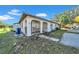 Inviting home exterior featuring an arched entrance, well-maintained landscape and convenient parking at 1618 39Th Avenue E Dr, Ellenton, FL 34222