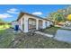 Inviting home exterior featuring an arched entrance, well-maintained landscape and convenient parking at 1618 39Th Avenue E Dr, Ellenton, FL 34222