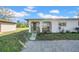 Charming single-story home exterior featuring an arched entryway and fresh landscaping, offering curb appeal at 1618 39Th Avenue E Dr, Ellenton, FL 34222