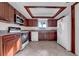 Kitchen featuring wood cabinetry, a microwave, and a white refrigerator at 1618 39Th Avenue E Dr, Ellenton, FL 34222