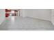 Open-concept living area featuring tile flooring, a view into the kitchen, and neutral paint at 1618 39Th Avenue E Dr, Ellenton, FL 34222
