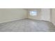 Bright living area featuring tile flooring, a view out of the window, and white paint at 1618 39Th Avenue E Dr, Ellenton, FL 34222