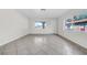 Bright living room with tile flooring, fresh paint, natural light, and neutral colors at 1618 39Th Avenue E Dr, Ellenton, FL 34222