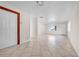 Bright living room with neutral walls, tile flooring, and a large window at 1618 39Th Avenue E Dr, Ellenton, FL 34222