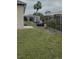 Backyard featuring a fence and ample space for gardening, with a patio and some storage at 23149 Hammond Ave, Port Charlotte, FL 33954