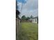 Large backyard with a wood fence providing privacy for outdoor activities and landscaping opportunities at 23149 Hammond Ave, Port Charlotte, FL 33954