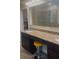 Bathroom featuring double vanity with granite countertop and large mirror reflecting walk-in shower at 23149 Hammond Ave, Port Charlotte, FL 33954