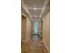Elegant foyer features tray ceiling, tile floors, and a front door with decorative glass panel at 23149 Hammond Ave, Port Charlotte, FL 33954