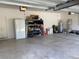 Spacious garage features ample storage space and includes a full-size refrigerator and water heater at 23149 Hammond Ave, Port Charlotte, FL 33954