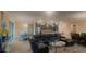 Open living room area showing the kitchen with stainless steel appliances and dining area at 23149 Hammond Ave, Port Charlotte, FL 33954