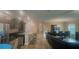 Bright open floor plan featuring kitchen with island, dining area, and comfortable living space at 23149 Hammond Ave, Port Charlotte, FL 33954