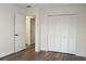 Cozy bedroom featuring clean white walls, modern vinyl floors and a closet at 3158 Idlewood St, North Port, FL 34287