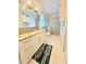 Clean bathroom with white cabinets, granite countertops, a shower with glass doors, and nautical-themed decor at 1706 S Lakeside Ct, Venice, FL 34293