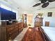 This is a spacious bedroom featuring wooden furniture, a TV, and decorative accents at 1706 S Lakeside Ct, Venice, FL 34293