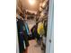 Walk-in closet featuring ample shelving and hanging storage space for clothing and accessories at 1706 S Lakeside Ct, Venice, FL 34293