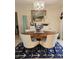 Elegant dining room with stylish chandelier and nautical-themed decor at 1706 S Lakeside Ct, Venice, FL 34293