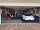 Spacious garage with epoxy floor and storage, ideal for car enthusiasts at 1706 S Lakeside Ct, Venice, FL 34293