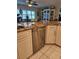 Updated kitchen featuring granite counters, stainless steel appliances, and stylish white cabinetry at 1706 S Lakeside Ct, Venice, FL 34293