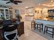 Open floor plan showcases the living room and kitchen with stainless steel appliances and granite countertops at 1706 S Lakeside Ct, Venice, FL 34293