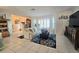 Inviting living room featuring comfortable seating, ample natural light, and stylish decor at 1706 S Lakeside Ct, Venice, FL 34293