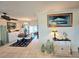 Bright and airy living room with open access to the dining area at 1706 S Lakeside Ct, Venice, FL 34293