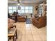 Bright and airy living area with tile floors and comfortable seating, perfect for relaxation at 1706 S Lakeside Ct, Venice, FL 34293