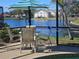 Inviting patio with comfortable seating and scenic waterfront view at 1706 S Lakeside Ct, Venice, FL 34293