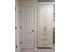 Built in storage cabinets and drawers next to interior door at 1706 S Lakeside Ct, Venice, FL 34293