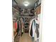 Organized walk-in closet with shelving, hanging rods, and storage, providing ample space for clothes and accessories at 1706 S Lakeside Ct, Venice, FL 34293