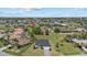 Sprawling community featuring well maintained homes, manicured lawns, and tropical palm trees at 218 Soursop, Punta Gorda, FL 33955