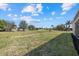 Spacious backyard offering plenty of room for recreation and relaxation with tropical landscaping at 218 Soursop, Punta Gorda, FL 33955