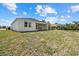 Expansive and well-maintained backyard featuring a covered patio, ideal for outdoor enjoyment at 218 Soursop, Punta Gorda, FL 33955