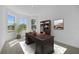 Bright office space offers plush carpeting, natural light, and ample desk space at 218 Soursop, Punta Gorda, FL 33955
