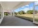 Covered patio overlooking the expansive, well-maintained backyard, perfect for outdoor entertaining at 218 Soursop, Punta Gorda, FL 33955