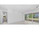 Bright bedroom featuring tile floors, lots of light, and a large sliding glass door leading to the outdoors at 349 Gold Tree, Punta Gorda, FL 33955