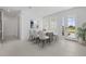 Bright dining area with modern table and chairs, adjacent to the entryway with natural light, and views of front yard at 349 Gold Tree, Punta Gorda, FL 33955