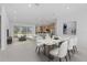 Open-concept living space featuring a dining area, kitchen with island, and a comfortable living room with lots of natural light at 349 Gold Tree, Punta Gorda, FL 33955