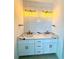 Bathroom vanity featuring dual sinks, quartz countertop, modern fixtures at 7343 N Ficus Tree, Punta Gorda, FL 33955