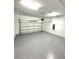 Clean garage with epoxy flooring and an automatic door at 7343 N Ficus Tree, Punta Gorda, FL 33955