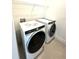 Functional laundry room with modern appliances and wire shelving for storage at 7343 N Ficus Tree, Punta Gorda, FL 33955