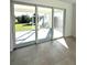 Sliding glass doors open to a screened patio and backyard at 7343 N Ficus Tree, Punta Gorda, FL 33955