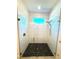 Modern shower with pebble flooring, glass door, and sleek fixtures at 7343 N Ficus Tree, Punta Gorda, FL 33955