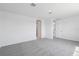 Spacious bedroom with neutral walls, soft carpeting, and closet space at 1844 Draughton Dr, Zephyrhills, FL 33541